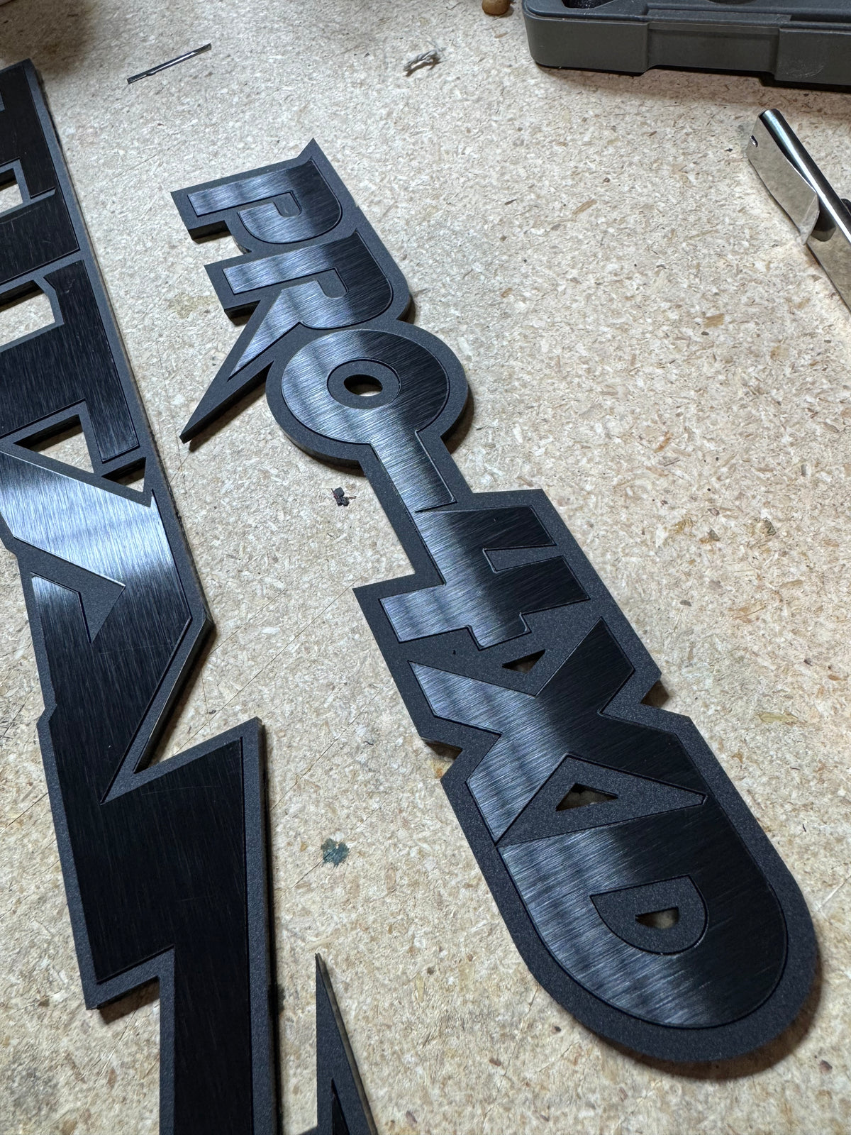 Custom Nissan Titan Emblems – 1/8″ Cast Acrylic with Black Edge & Brushed Black Inlay
