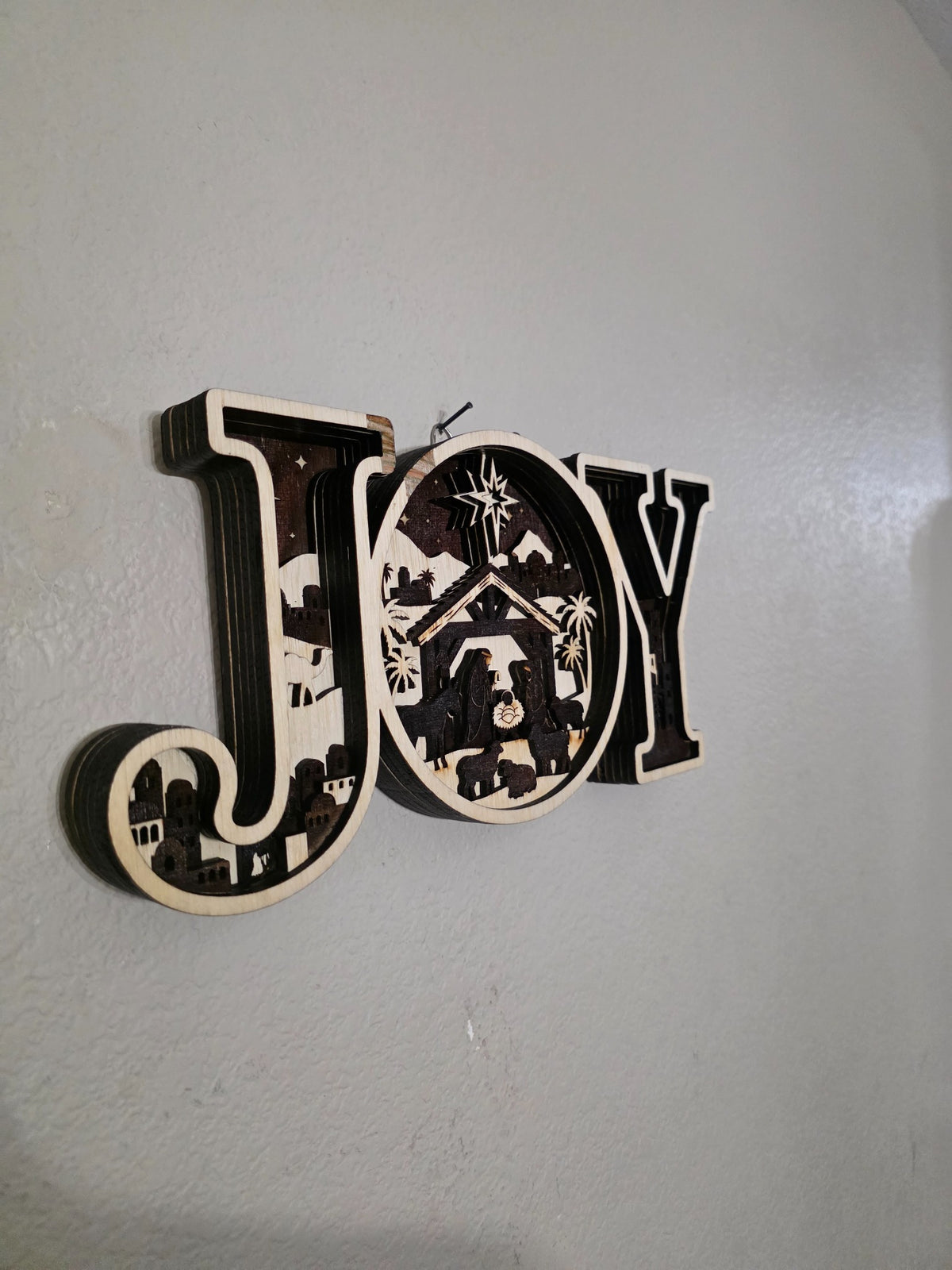 Left side angle of JOY nativity layered wood wall art