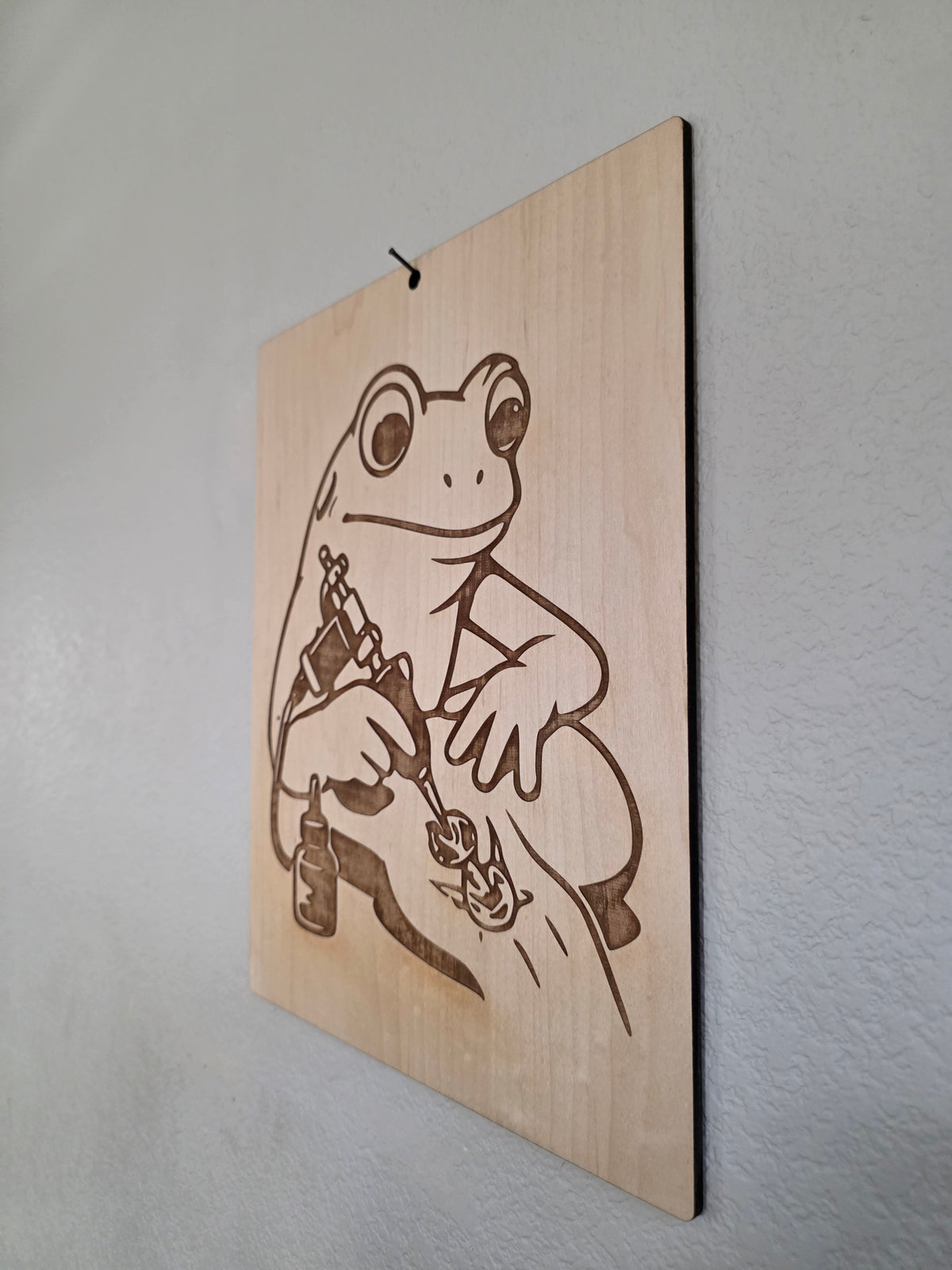 Tattoo Artist Frog – 11" x 17" Engraved Maple Wall Art