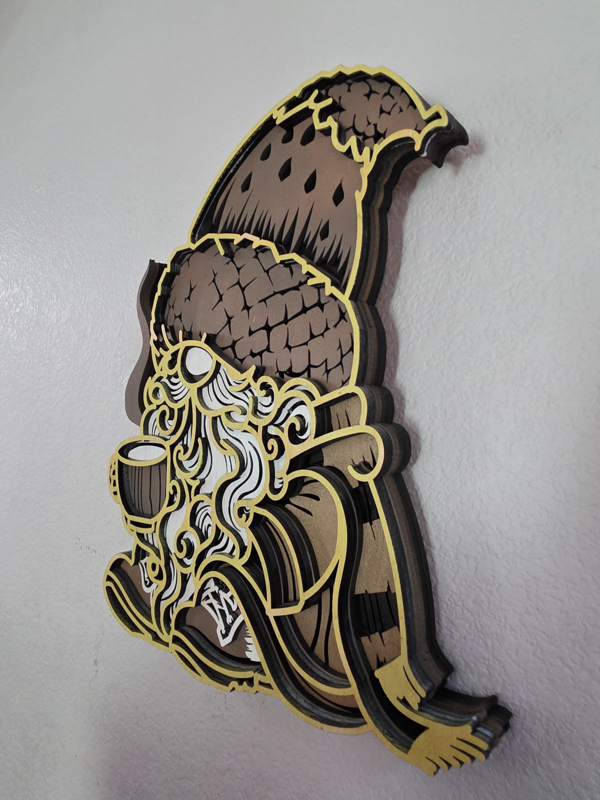 Side view of cozy layered wood autumn gnome wall art with coffee cup and dimensional construction
