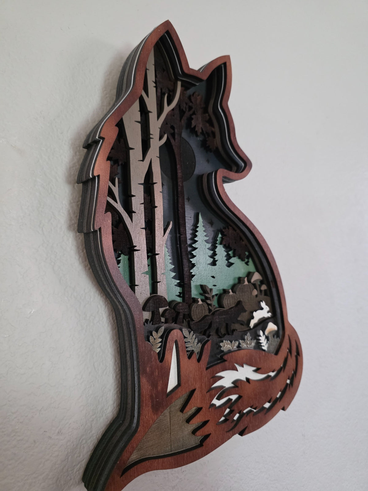 Angled side view of layered wooden fox forest wall art showing dimensional stacked wood layers