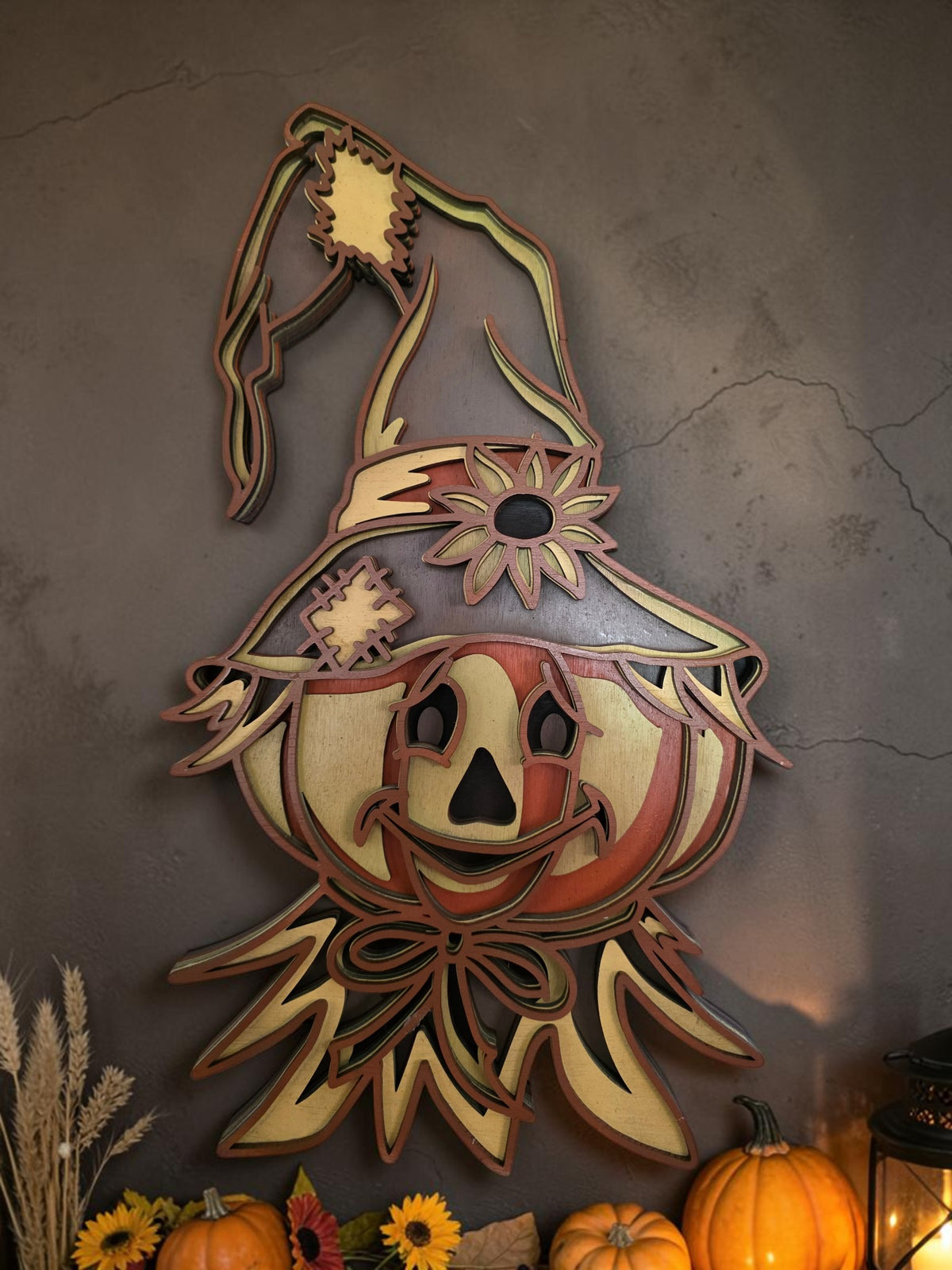 Layered wooden scarecrow pumpkin wearing a floppy witch hat with sunflower, fall and Halloween wall decor